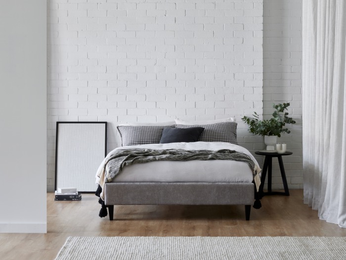 Modern bedroom containing Cannes double upholstered bed base in grey