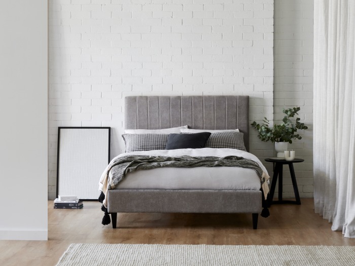 Modern bedroom containing Cannes double upholstered bed base in grey