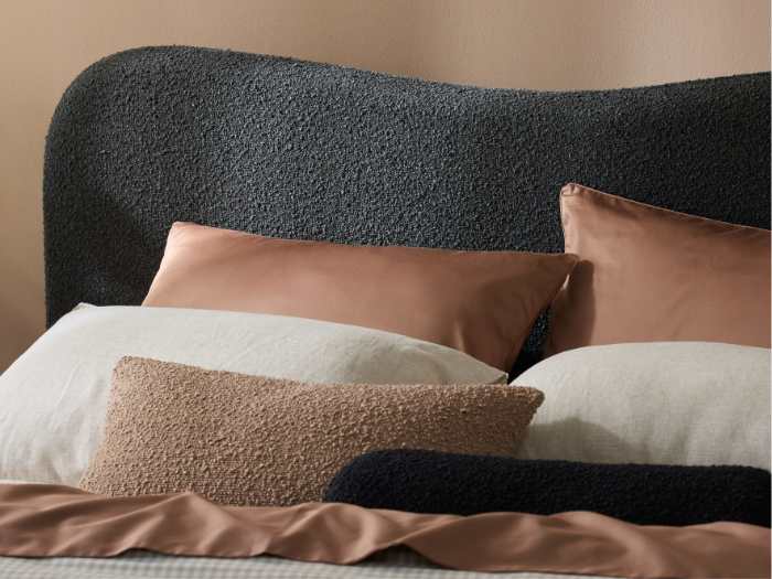 Close up photo of Cove Boucle Queen Bed | Black Boucle Fabric