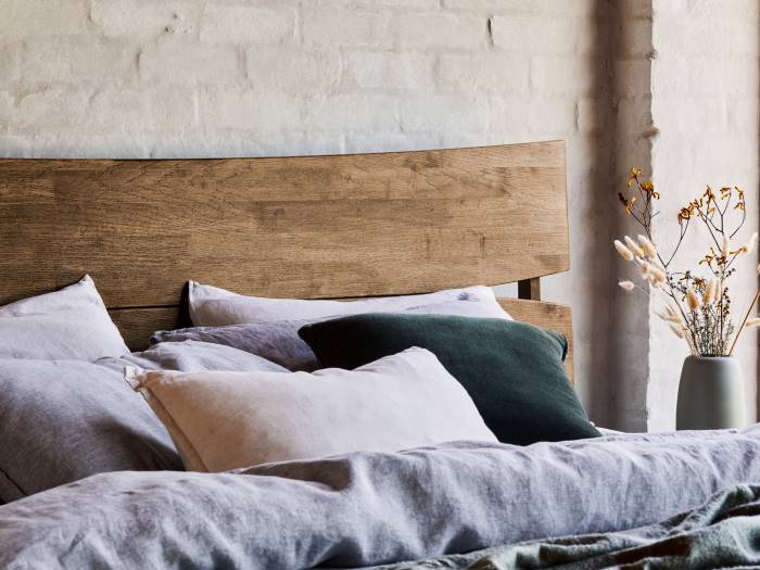 Close up of Room with Modern Bedroom Furniture containing Cruz Hardwood King Size Bed Frame with Rustic Walnut Finish