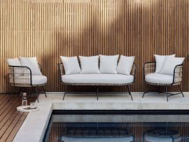 Modern outdoor space containing Arden 3PCE Bamboo Wicker Outdoor Lounge Set.