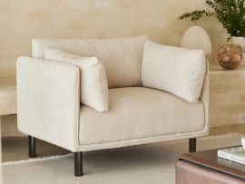 Close up photo of Coco Occasional Armchair Sofa in eco-friendly beige fabric in modern living space