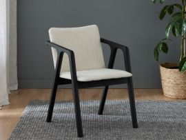 Photo of Elm Dining Chair with black hardwood and beige fabric in modern dining room.