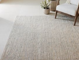 Close up of Elora Area Cotton Rug in Beige in modern living room