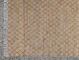 Close up picture of Myra Jute Pattern Rug in Mustard in a modern living room