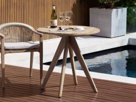 Modern outdoor area containing Panay Round Acacia Outdoor Dining Table