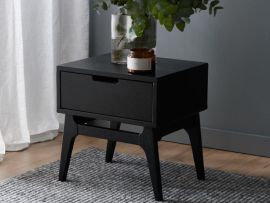 Photo of paris black sustainable hardwood bedside table in modern bedroom. 