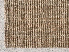 Close up of Sumba Jute Area Rug in Natural in a modern living room