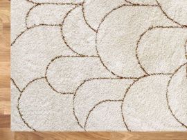 Close up image of Turret Pattern Area Rug in Beige in a modern living room
