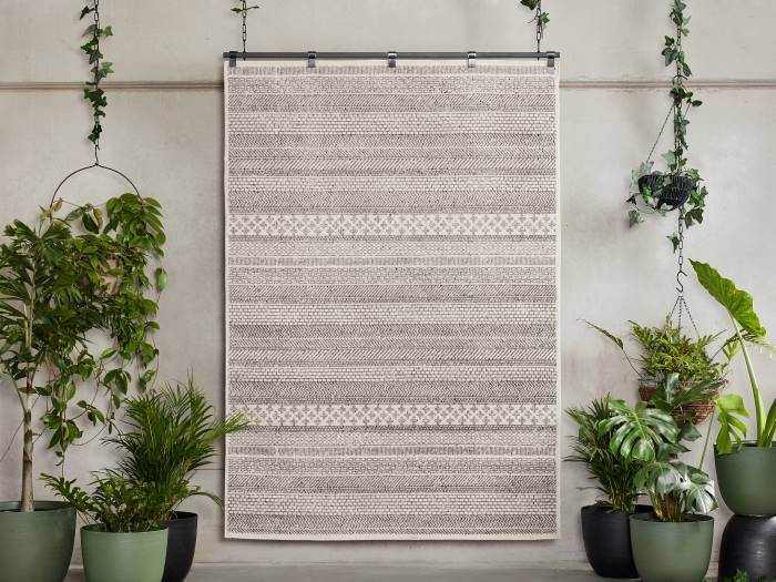 Photo of Ash Scandi Indoor Area Rug hanging from rod