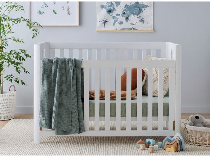 Photo of modern nursery containing Aster 2PCE Hardwood Convertible Baby Cot and Changing Table Set in White