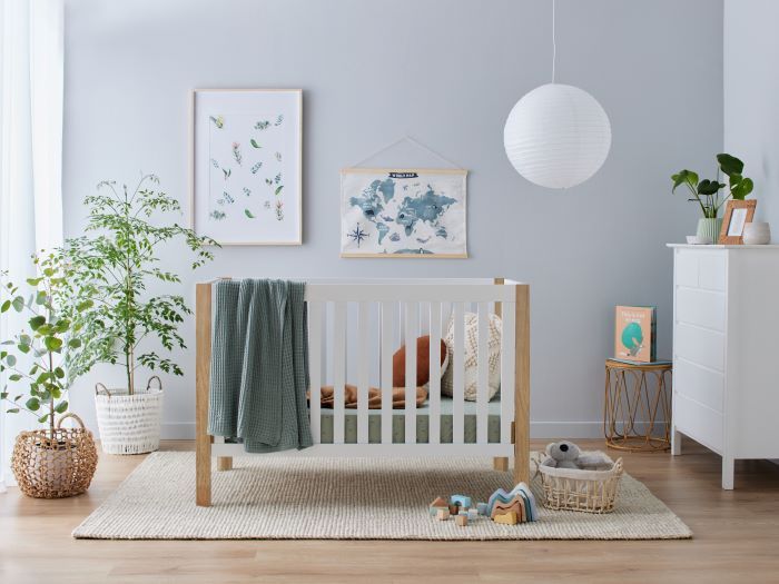Photo of modern nursery with Aster Hardwood Convertible Baby Cot in White and Natural