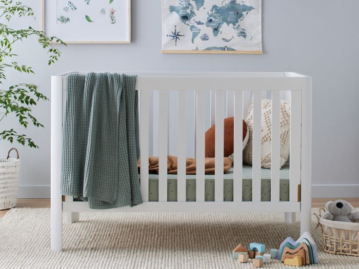 Photo of modern nursery furniture containing  Aster Hardwood Baby Cot in White
