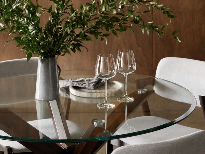 close up of Room with Modern Dining Furniture containing Bella Round Glass Top Dining Table with Dark Hardwood Frame