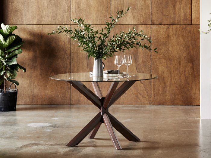 Round glass dining table with dark wood base sale