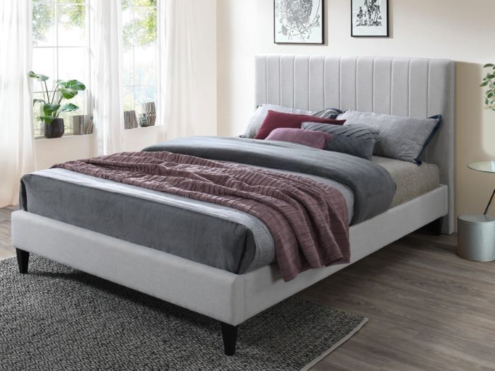 Modern bedroom containing Cannes double upholstered bed base in beige