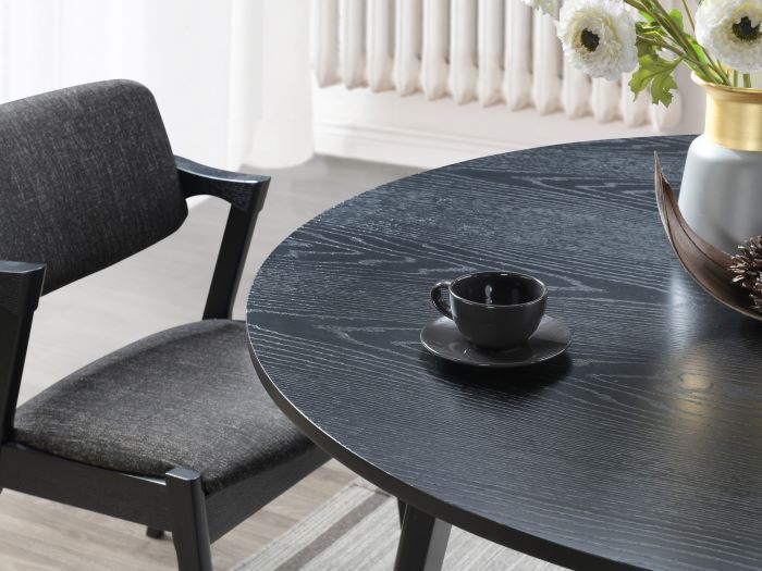 Modern dining room containing Cannes 5PCE Round Black Hardwood Dining Set with Black Fabric