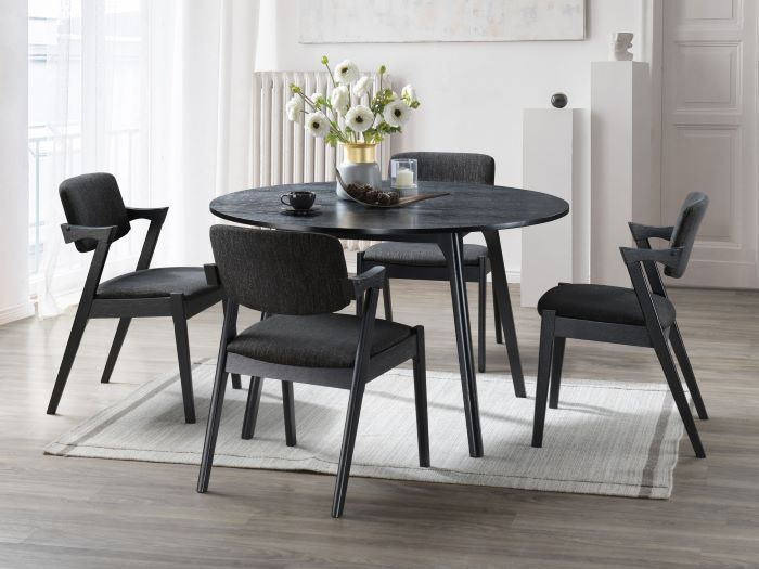 Modern dining room containing Cannes Round Black Hardwood Dining Table and Bella Dining Chairs 
