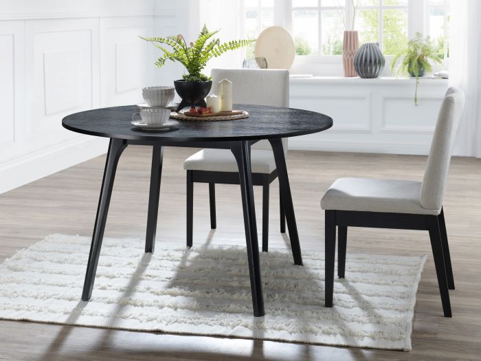 Modern dining room containing Cannes Round Black Hardwood Dining Table