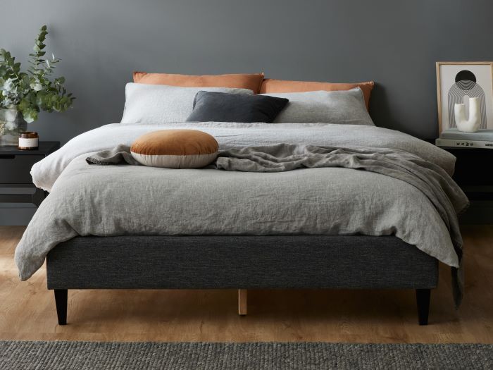 Photo of a modern bedroom containing Cannes Queen Upholstered Bed Base in Charcoal Fabric
