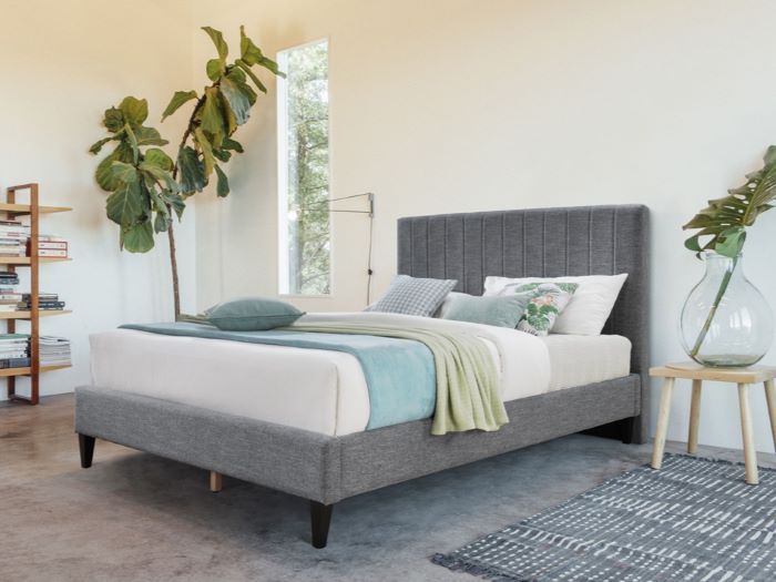 Photo of modern bedroom containing Cannes queen upholstered headboard in charcoal fabric