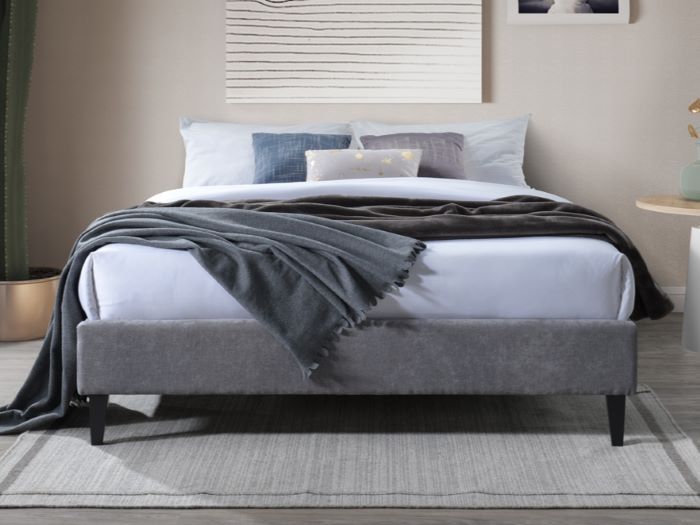 Modern bedroom containing Cannes queen upholstered bed base in  grey