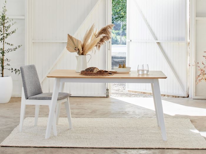 Modern dining space containing Finn hardwood dining table and dining chair in white and grey