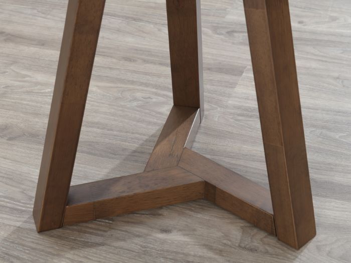 Close up photo of modern living room containing Franki round hardwood side table in walnut