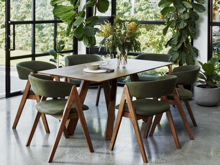 photo of Gaudi walnut dining table with Gaudi hardwood dining chairs in green fabric