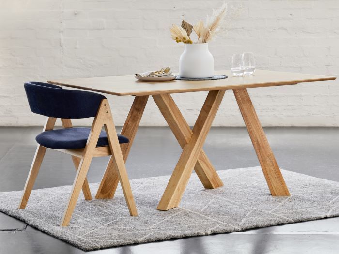 photo of Gaudi natural dining table with Gaudi hardwood dining chair in navy fabric