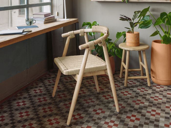 Photo of modern idris outdoor dining chair with hardwood legs and beige rope seat