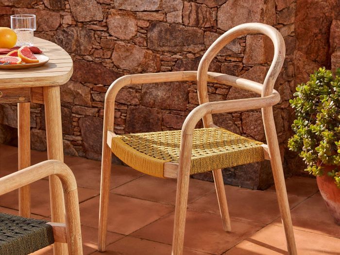 close up of julia outdoor dining chair with mustard yellow rope in modern outdoor setting
