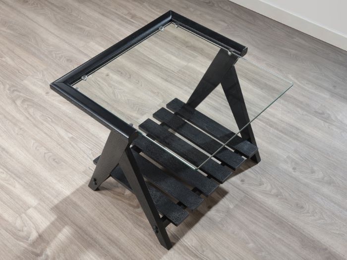 modern living room containing Myer glass top side table with black hardwood