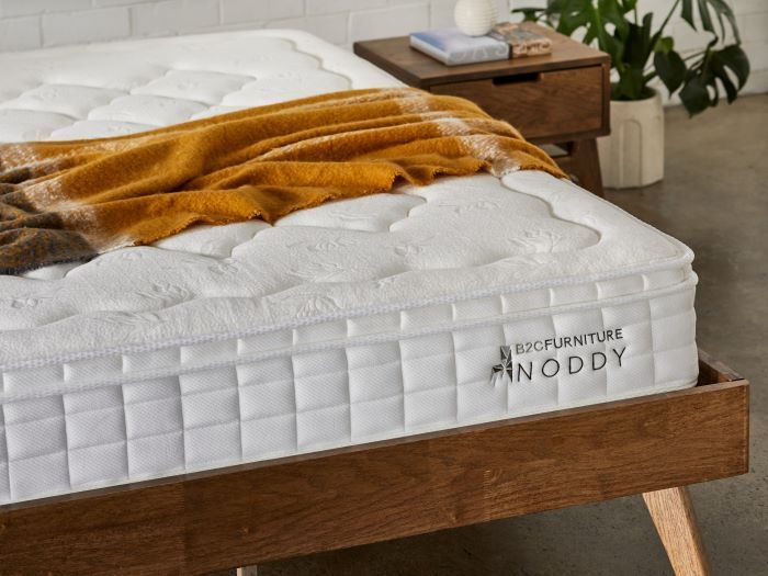 close up photo of noddy double sized mattress dressed
