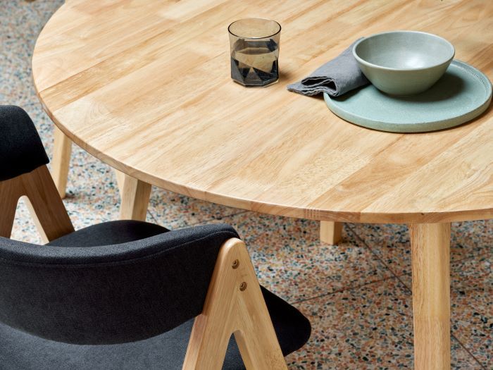 Close up photo of modern dining room containing Oslo 5PCE hardwood dining set in natural and black