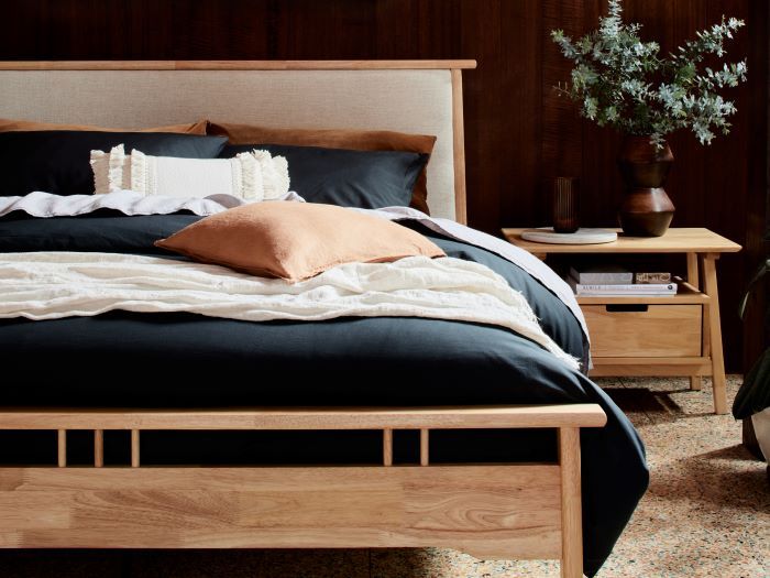 close up of room with modern bedroom furniture containing Oslo Queen Bed Frame in Natural hardwood