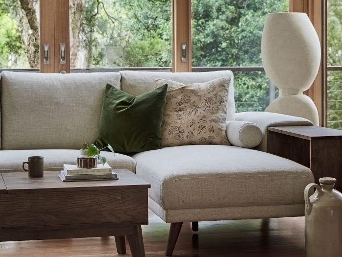 Close up of room with modern living room furniture containing Paris Modular Sofa Series with L-Shape Sofa Chaise in Beige Fabric