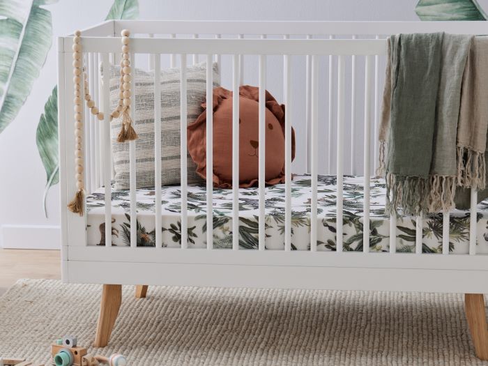 Close up Photo of modern nursery furniture containing Rio 2-in-1 Hardwood Baby Cot in White and Natural