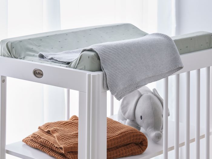 Close up photo of modern nursery with Rio Hardwood Changing Table in White