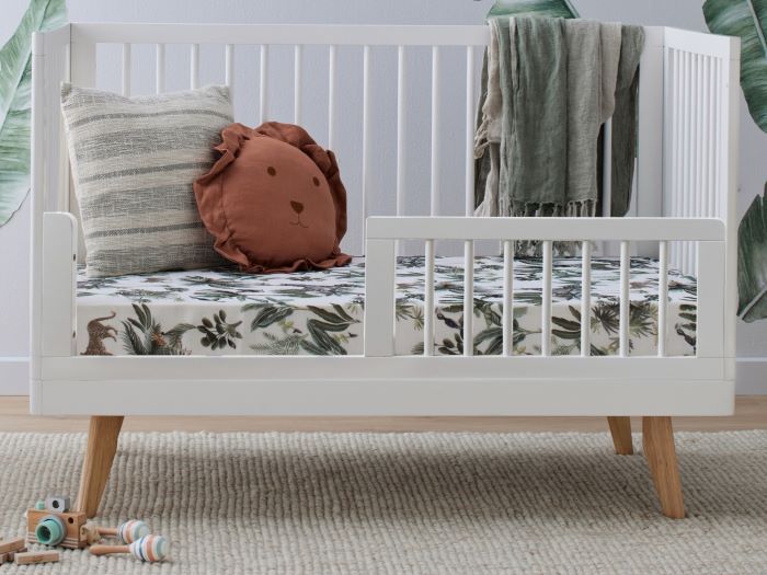Close up photo of modern nursery containing Rio Hardwood Side Guard Rail in White