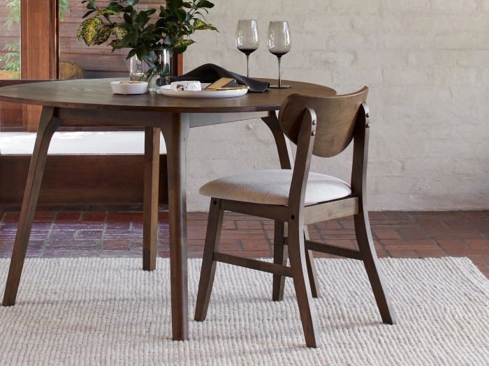 close up photo of Soho hardwood dining chair in walnut with beige fabric in modern dining room