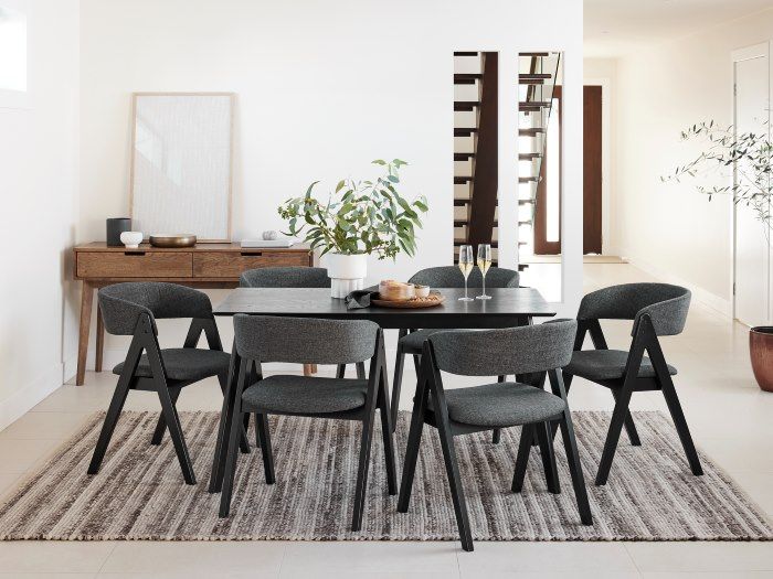 Wooden dining table black chairs deals