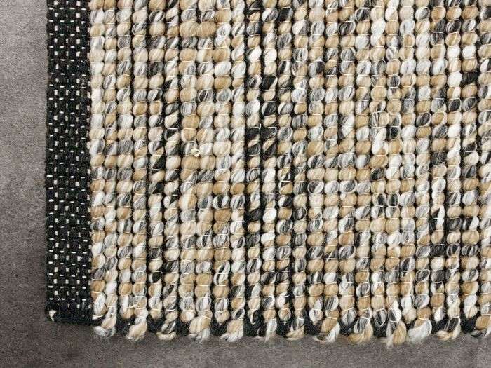 Close up photo of Shetland Area Rug in Beige in a modern living room